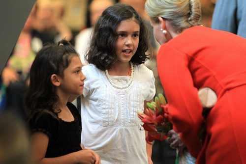 RUTH BONNEVILLE / WINNIPEG FREE PRESS  Countess of Wessex chats with Samantha Schlosser and her little sister Isabella from Brandon after they gave her flowers from their family garden while she tours  of Deer Lodge for its 100th birthday Wednesday.   June 22 / 2016