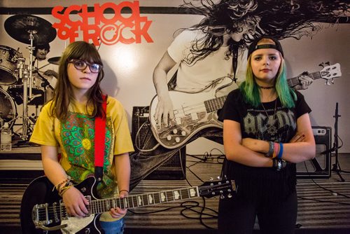 Jessica McEachern, 17, and Phoenix Iwanchuk, 16, stand in front of a mural at the School of Rock jam space on Corydon Avenue. June 18th. 2016 (WINNIPEG FREE PRESS/GREG GALLINGER)