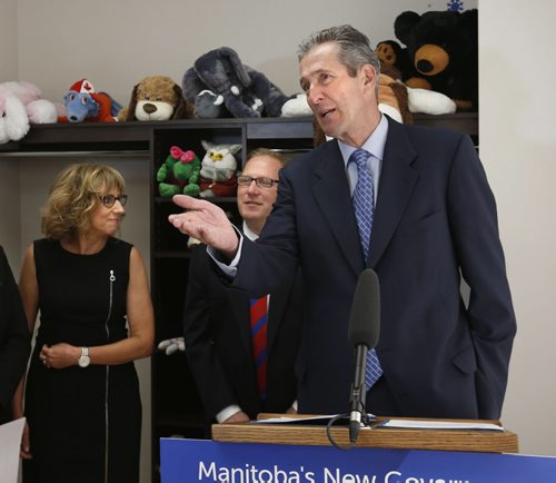 WAYNE GLOWACKI / WINNIPEG FREE PRESS   Premier Brian Pallister gives details of new legislation to better protect children in Manitoba at at a news conference held Thursday at the Snowflake Place for Children and Youth. In back is Families Minister Scott Fielding and Cheryl Martinez, Executive Director of Snowflake Place for Children and Youth. Larry Kusch story June 23  2016