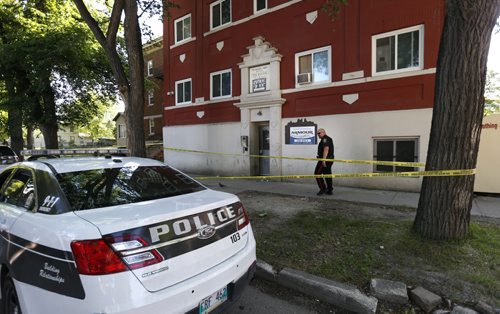 WAYNE GLOWACKI / WINNIPEG FREE PRESS    Winnipeg Police at the scene of an apartment building in the 400 block of Furby Street Thursday morning.  At about 3 a.m. Thursday, an adult  was rushed to hospital in critical condition and later died.   Kevin Rollason story June 23  2016