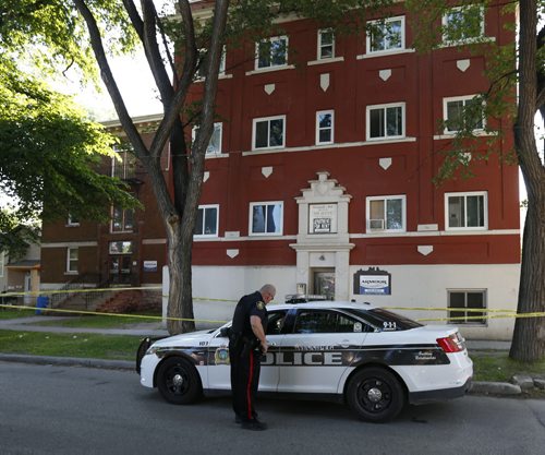 WAYNE GLOWACKI / WINNIPEG FREE PRESS    Winnipeg Police in front of a apartment building in the 400 block of Furby Street Thursday.  At about 3 a.m. Thursday, an adult  was rushed to hospital in critical condition and later died.   Kevin Rollason story June 23  2016