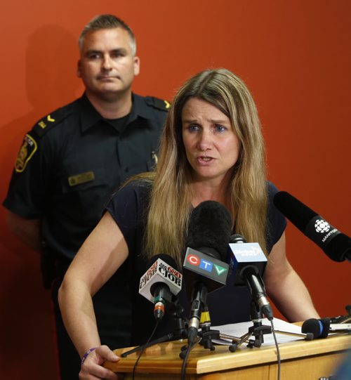 WAYNE GLOWACKI / WINNIPEG FREE PRESS   Winnipeg Police Det. Sgt. Shaunna Neufeld, coordinator of the Missing Persons Unit,  pleaded with Sandra Giesbrecht as one mother to another to bring back Montana, 11, and Josh, 9,  In back is Cost. Jason Michalyshen  at news conference Thursday in the Police Head Quarters Building.  Kevin Rollason story. June 23  2016