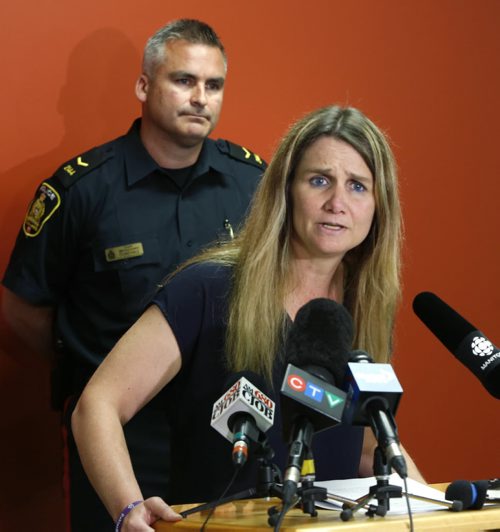 WAYNE GLOWACKI / WINNIPEG FREE PRESS   Winnipeg Police Det. Sgt. Shaunna Neufeld, coordinator of the Missing Persons Unit,  pleaded with Sandra Giesbrecht as one mother to another to bring back Montana, 11, and Josh, 9,  In back is Cost. Jason Michalyshen  at a news conference Thursday in the Police Head Quarters Building.  Kevin Rollason story. June 23  2016
