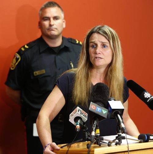 WAYNE GLOWACKI / WINNIPEG FREE PRESS   Winnipeg Police Det. Sgt. Shaunna Neufeld, coordinator of the Missing Persons Unit,  pleaded with Sandra Giesbrecht as one mother to another to bring back Montana, 11, and Josh, 9,  In back is Cost. Jason Michalyshen  at news conference Thursday in the Police Head Quarters Building.  Kevin Rollason story. June 23  2016