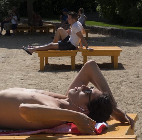 ZACHARY PRONG / WINNIPEG FREE PRESS

Ben Kissock catches some rays near The Forks dock on June 23, 2016.
