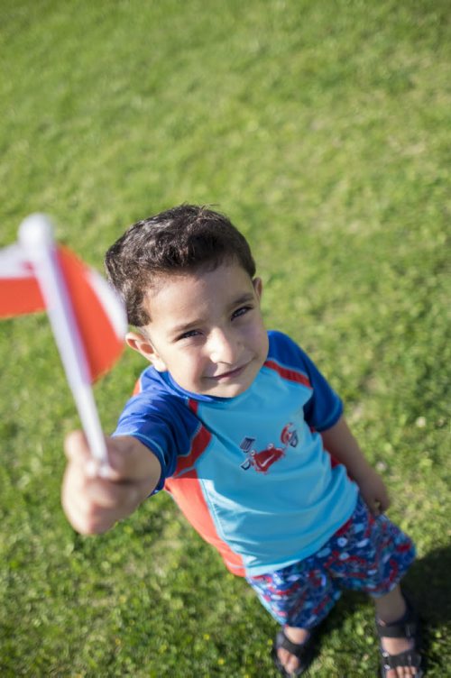 ZACHARY PRONG / WINNIPEG FREE PRESS  Hussein Alassaf, 5, plays outside of a local community centre where his parents study English each week. June 15, 2016.