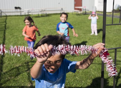 ZACHARY PRONG / WINNIPEG FREE PRESS  The children play outside a community centre while their parents study English. June 15, 2016.