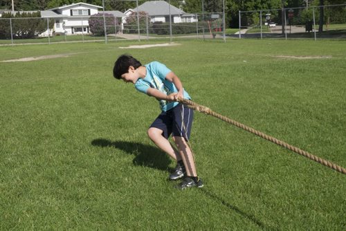 ZACHARY PRONG / WINNIPEG FREE PRESS  Rodi Souleyman, 8, plays tug of war at school on June 15, 2016.