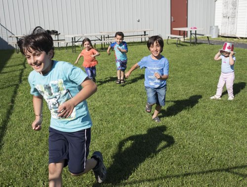 ZACHARY PRONG / WINNIPEG FREE PRESS  The children play outside a community centre while their parents study English. June 15, 2016.