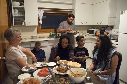 ZACHARY PRONG / WINNIPEG FREE PRESS  The sponsors and families have grown close over the past four months and often spend time together. Here they break fast during the Holy month of Ramadan. June 14, 2016.