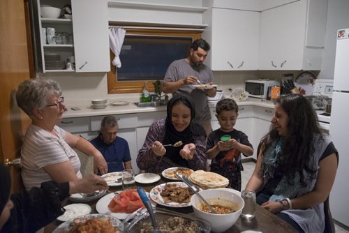 ZACHARY PRONG / WINNIPEG FREE PRESS  The sponsors and families have grown close over the past four months and often spend time together. Here they break fast during the Holy month of Ramadan. June 14, 2016.