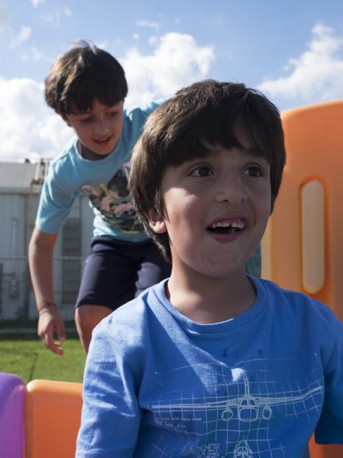 ZACHARY PRONG / WINNIPEG FREE PRESS  Yourself Almasalmeh, 7, and Rodi Salesman, 8, play outside of a local community centre where their parents study English each week. June 15, 2016.