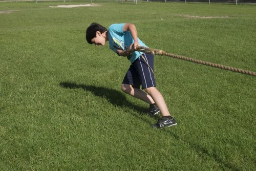 ZACHARY PRONG / WINNIPEG FREE PRESS  Rodi Souleyman, 8, plays tug of war at school on June 15, 2016.