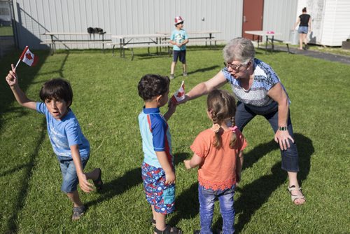 ZACHARY PRONG / WINNIPEG FREE PRESS  The children play outside a community centre while their parents study English. June 15, 2016.