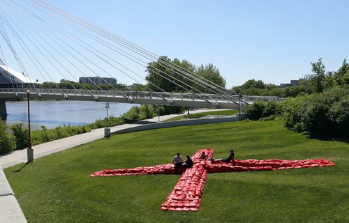 WAYNE GLOWACKI / WINNIPEG FREE PRESS   The Forks, StorefrontMB and La Maison des artistes launched the fourth annual Cool Gardens exhibition Friday. One of the new installations chosen by an international competition is " Big Red" by Saskatchewan based OPEN Design Collaborative and Winnipeg's Mark Bauche just east of the Canadian Museum for Human Rights.  The giant X made of over 1000 red sandbags marks the natural and cultural intersection of the Red and Assiniboine Rivers. Nine garden installations will be on display from June 24 to Sept 18 at various locations in Manitoba including The Forks, St Boniface, Waterfront Drive and the Riverbank Discovery Centre in Brandon,Mb.   see release June 24  2016