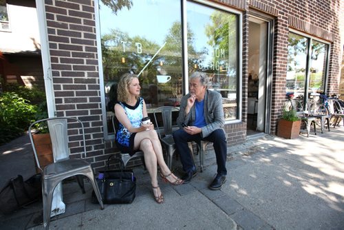 RUTH BONNEVILLE / WINNIPEG FREE PRESS  Free Press columnist Gordon Sinclair interviews Maria Mitousis, a victim of a bomb blowing up in a package she opened a year ago, at a coffee shop in the Wolsely area Friday.   Gordon Sinclair story.  June 23 / 2016