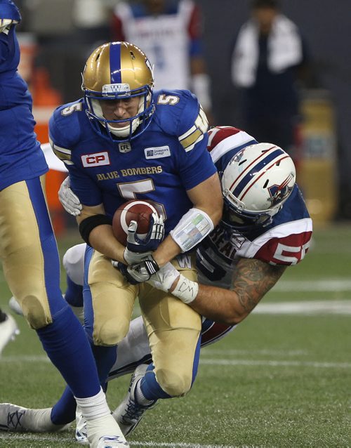 JOE BRYKSA / WINNIPEG FREE PRESS Winnipeg Blue Bombers QB Drew Willy is sacked by Montreal Allouettes Jamaa Westerman during first half CFL action at Investors Group Field-June 24, 2016  -(See story)