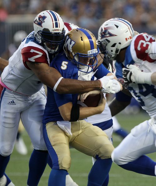 JOE BRYKSA / WINNIPEG FREE PRESS Winnipeg Blue Bombers QB Drew Willy is sacked by  Montreal Allouettes John Bowman during first half CFL action in Winnipeg at Investors Group Field -June 24, 2016  -(See story)
