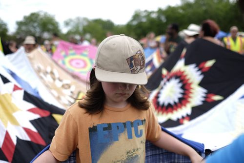ZACHARY PRONG / WINNIPEG FREE PRESS  Hunter Humphrey, 10, participates in a blanket dance fundraiser organized by the Families First Foundation during Aboriginal Day Live at The Forks. The Families First Foundation supports the families of Missing and Murdered Indigenous Women and Girls. June 25, 2016.