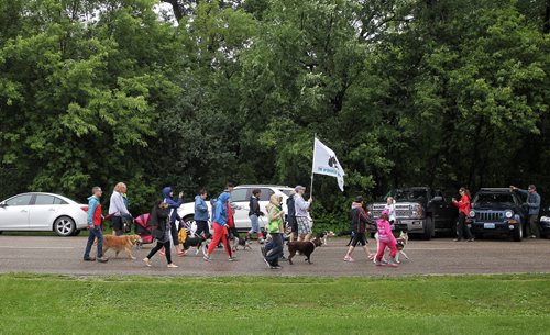 MIKE DEAL / WINNIPEG FREE PRESS  Participants stride along the road in Assiniboine Park taking part in the Paws in Motion walk-a-thon which has steadily grown into the Winnipeg Humane Societys largest fundraising event of the year.   160626 Sunday, June 26, 2016