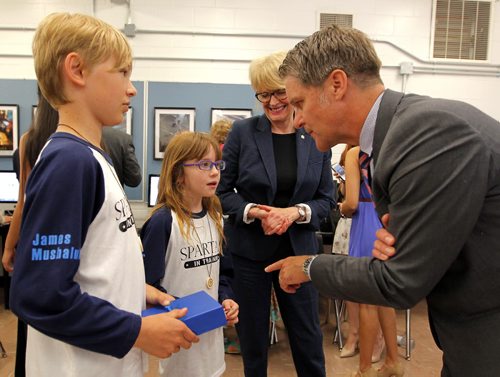 BORIS MINKEVICH / WINNIPEG FREE PRESS L-R Luxton Elementry School's James Mushaluk, and Cooper Vint chat with Winnipeg School Division 1 Chief Superintendant Pauline Clarke and MB Minister of Finance Cameron Friesen at Sisler Highschool where a government credit program was announced. The kids are doing award winning work in coding and gaming and will benefit eventually take advantage of the new tax credit program. June 27, 2016.