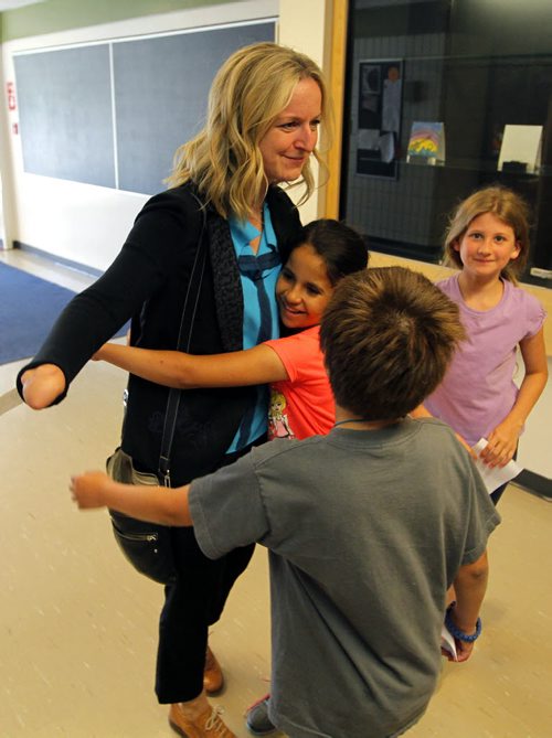 BORIS MINKEVICH / WINNIPEG FREE PRESS Beaverlodge School - Photos of package bomb survivor Maria Mitousis with teacher Barb Thiessen and the Grades 3/4 class.  Maria has developed a special relationship with since the students individually wrote to her and lifted her spirits last fall, just four months after she lost her hand and part of her right arm as a result of  the explosion. Sinclair Tuesday column. June 27, 2016.