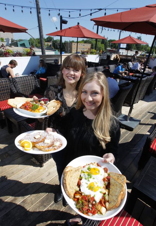 BORIS MINKEVICH / WINNIPEG FREE PRESS (L-R) General Manager Meghan Thiessen and assistant general manager Samara Pinto pose for a photo with some food at Stellas at 1463 Pembina (at Clarence). Photo taken on the rooftop patio. L-R  Baked eggs, French toast, and chorizo hash. Alison Gillmor review. June 28, 2016.