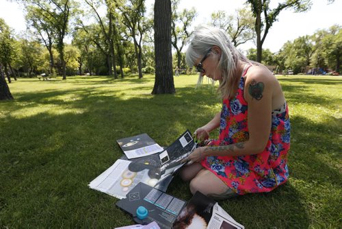 WAYNE GLOWACKI / WINNIPEG FREE PRESS  49.8 ZINES.  Meg Crane is the creator of a local zine called Cockroach, and likes to make her zines/envelopes in Vimy Ridge Park . Aidan Geary Story June 28  2016