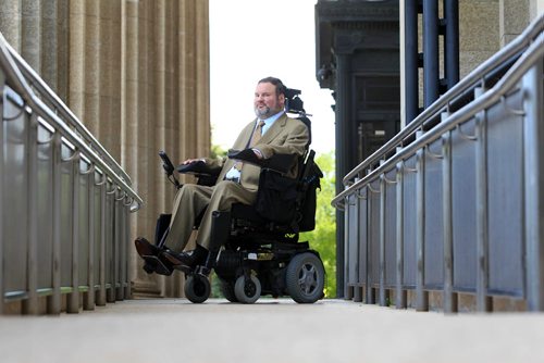 RUTH BONNEVILLE / WINNIPEG FREE PRESS  Assiniboia MLA Steven Fletcher, poses at the top of the ramp to the Legislative Building Tuesday morning after challenging plans for renovating the chamber to accommodate wheelchair access.  Feature photo for story.   See Larry Kusch story.    June 28 / 2016