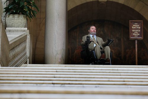 RUTH BONNEVILLE / WINNIPEG FREE PRESS  Assiniboia MLA Steven Fletcher, stops at the top of the stairs in the Legislative Building Tuesday morning after challenging plans for renovating the chamber to accommodate wheelchair access.  Feature photo for story.   See Larry Kusch story.    June 28 / 2016