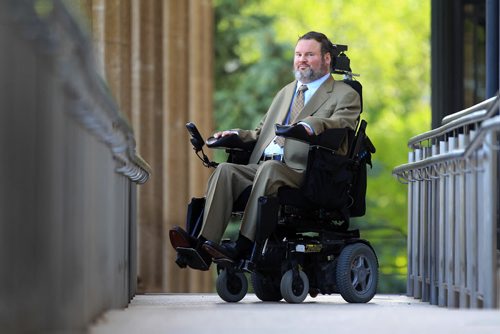 RUTH BONNEVILLE / WINNIPEG FREE PRESS  Assiniboia MLA Steven Fletcher, stops at the top of the ramp outside the Legislative Building Tuesday morning after challenging plans for renovating the chamber to accommodate wheelchair access.  Feature photo for story.   See Larry Kusch story.    June 28 / 2016