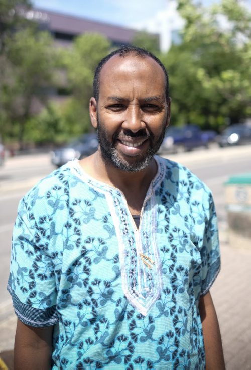 ZACHARY PRONG / WINNIPEG FREE PRESS  Abdi Ahmed, the coordinator of Immigration Partnership Winnipeg, outside of his office on June 28, 2016.