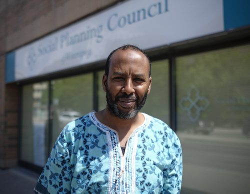 ZACHARY PRONG / WINNIPEG FREE PRESS  Abdi Ahmed, the coordinator of Immigration Partnership Winnipeg, outside of his office on June 28, 2016.