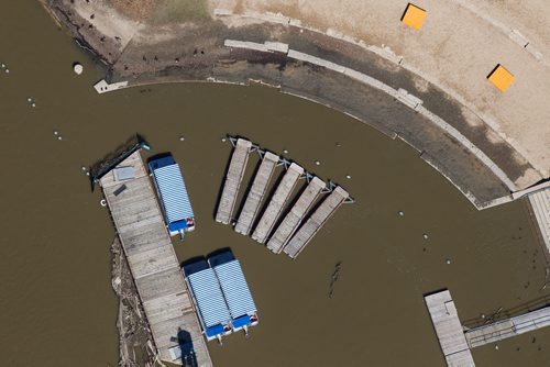 MIKE DEAL / WINNIPEG FREE PRESS Water taxis sit parked at the flooded marina and River Walk at The Forks. Several rain storms in the last number of days has caused  high water on the Assiniboine River. 160628 - Tuesday, June 28, 2016