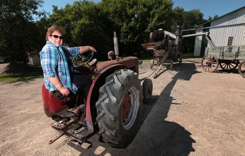 PHIL HOSSACK / WINNIPEG FREE PRESS -  Rosemarie Klym poses sitting in the driver's seat of a tractor she and her husband found recently. It belonged origionally to her father and was used on her home farm. The antique now will join the family trek to the Austin Thresherman's Reunion. - See Bill Redekop story. June 28, 2016