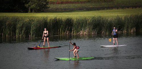 PHIL HOSSACK / WINNIPEG FREE PRESS -   A class of novices paddleboarders at Fun Mountain Tuesday evening. - See Dave Sanderson's  story. June 28, 2016