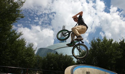 RUTH BONNEVILLE / WINNIPEG FREE PRESS  John Fieber get some air with his stunt bike while riding the pit at the Forks Skate Park Wednesday morning.  The skate park is celebrating its 10th anniversary this year.   Standup photo   June 29 / 2016