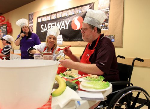 RUTH BONNEVILLE / WINNIPEG FREE PRESS  Free Press columnist Doug Speirs, competes in celebrities Cook-Off for kids at Safeway at Madison Square Wednesday to raise funds and awareness for the smd Foundation (Easter Seals). Michelle Lissel with Global (blond, to Doug's right), Nesta Mathews with KISS 102.3 and Drew Kozub with KISS 102.3,  also took part in the cook-off.  Tricialynn Morgan with smd Foundation was the host (purple).    June 29 / 2016