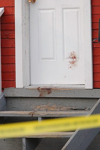 BORIS MINKEVICH / WINNIPEG FREE PRESS  080414 Door of 647 College Ave. with something on it that may be, but not confirmed by the photographer, blood.