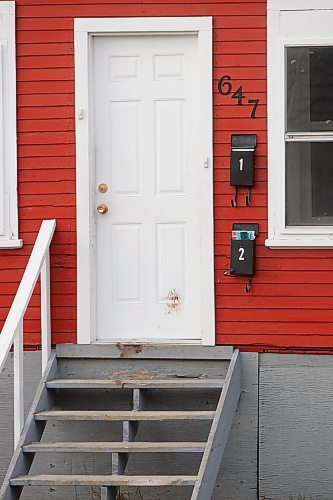 BORIS MINKEVICH / WINNIPEG FREE PRESS  080414 Door of 647 College Ave. with something on it that may be, but not confirmed by the photographer, blood.