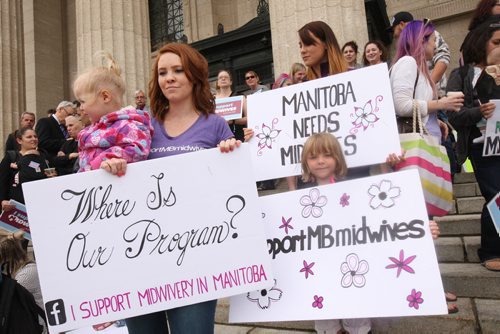 JOE BRYKSA / WINNIPEG FREE PRESS   About 100 people attended a protest in support of Manitoba midwifery students- Including Laura Wiebe a midwifery student, with her kids Charlie ( Baby girl) and Carman, right-June 30, 2016  -(See Nick Martin story)