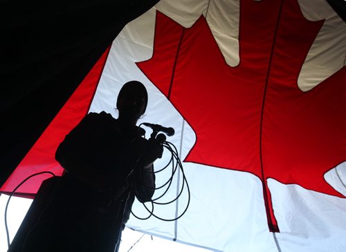 RUTH BONNEVILLE / WINNIPEG FREE PRESS   Sound Technician Matt Boyer with Sound Art sets up a microphone on stage at the Lyric Thursday afternoon  in preparation for Canada Day Celebrations.   Standup photo  June 30 / 2016