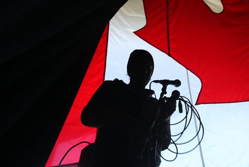 RUTH BONNEVILLE / WINNIPEG FREE PRESS   Sound Technician Matt Boyer with Sound Art sets up a microphone on stage at the Lyric Thursday afternoon  in preparation for Canada Day Celebrations.   Standup photo   June 30 / 2016