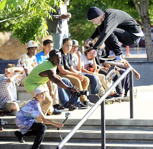 PHIL HOSSACK / WINNIPEG FREE PRESS - Professional Sk8'er Chris Wimer, of North Carolina,  rides the rail at the Forks Skate Plaza Thursday evening at a demo and trick competition celebrating the 10th anniversary of the popular park. See Ashley Prest story. June 30, 2016