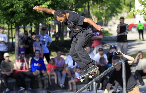 PHIL HOSSACK / WINNIPEG FREE PRESS - California professional Sk8'er Forrest Edwards rides the rail at the Forks Skate Plaza Thursday evening at a demo and trick competition celebrating the 10th anniversary of the popular park. See Ashley Prest story. June 30, 2016