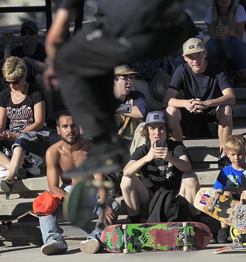 PHIL HOSSACK / WINNIPEG FREE PRESS - Local baorders watch and learn at the Forks Skate Plaza Thursday evening at a demo and trick competition celebrating the 10th anniversary of the popular park. See Ashley Prest story. June 30, 2016