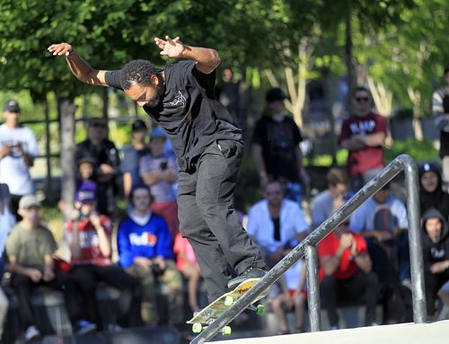 PHIL HOSSACK / WINNIPEG FREE PRESS - California professional Sk8'er Forrest Edwards rides the rail at the Forks Skate Plaza Thursday evening at a demo and trick competition celebrating the 10th anniversary of the popular park. See Ashley Prest story. June 30, 2016