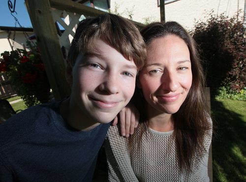 PHIL HOSSACK / WINNIPEG FREE PRESS - Volunteer - Sarah Hampton, 38, and her son Iszac Roy, 12. who will be volunteering for the first time at this year's festival. They both got their start with the festival's Apprentice Program. Aaron Epp's story. June 30, 2016