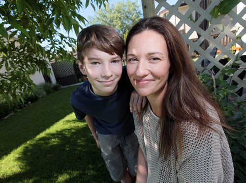 PHIL HOSSACK / WINNIPEG FREE PRESS - Volunteer - Sarah Hampton, 38, and her son Iszac Roy, 12. who will be volunteering for the first time at this year's festival. They both got their start with the festival's Apprentice Program. Aaron Epp's story. June 30, 2016