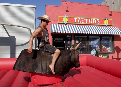 ZACHARY PRONG / WINNIPEG FREE PRESS  Miguel of Manitoba's Mechanical Bull goes for a ride at Osborne Village on July 2, 2016.